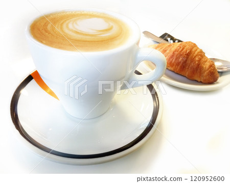 Cup of coffee with croissant on the white background. 120952600