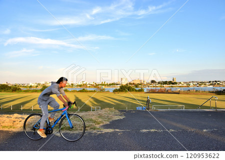 A man riding on the cycle path at Umairi Fureai Park A man riding on the cycle path at Umairi Fureai Park 120953622