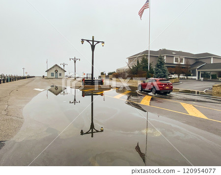 Calm Morning at the Waterfront With Reflections and a Lingering Fog Over the Town Calm Morning at the Waterfront With Reflections and a Lingering Fog Over the Town 120954077