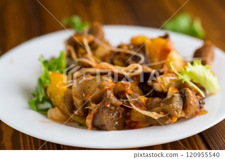 vegetable stew with eggplants, on a wooden table vegetable stew with eggplants, on a wooden table 120955540
