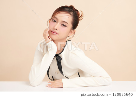 Beautiful young asian woman with clean fresh skin on beige background, Face care, Facial treatment, Cosmetology, beauty and spa, Asian women portrait. 120955640