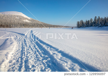 Skiing on a Frozen Lake on a Sunny Winter Day Skiing on a Frozen Lake on a Sunny Winter Day 120956897