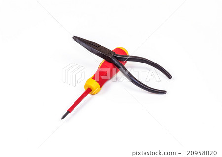 Screwdriver and pliers lie on a light background. On a light background lie a screwdriver and pliers Screwdriver and pliers lie on a light background. On a light background lie a screwdriver and pliers 120958020