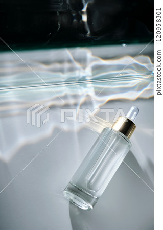 Bottle of face serum with a pipette with a beautiful highlight. 120958301