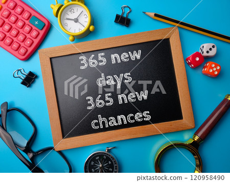 Top view wooden board with text 365 new days and new chances on a blue background. Business concept. 120958490