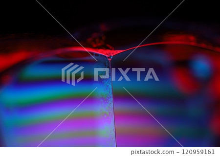 Red and blue fluid reflections on black background, liquid abstraction, colour waves, deep dark backgrounds, geometric water shapes 120959161