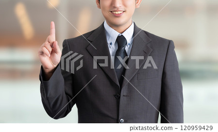 Male business man pointing with his index finger up Male business man pointing with his index finger up 120959429
