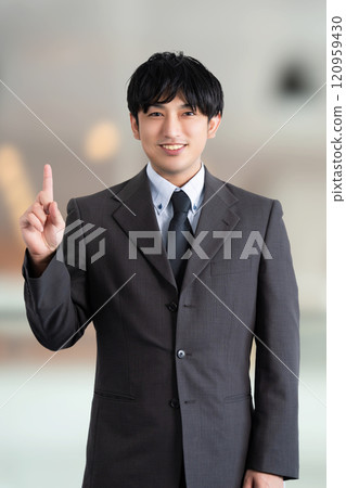 Male business man pointing with his index finger up 120959430