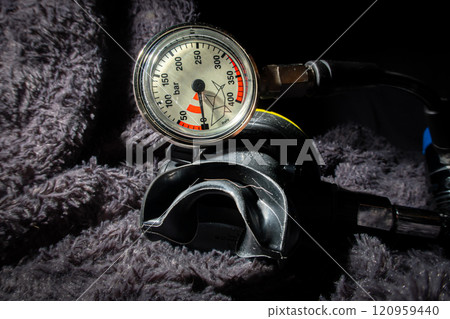 Scuba diving pressure gauge and a second stage air regulator close up 120959440