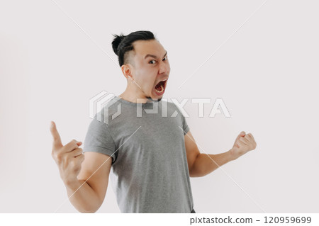 Angry and furious shouting face of man in grey t-shirt isolate on white. Angry and furious shouting face of man in grey t-shirt isolate on white. 120959699