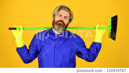 Yardman occupation. Bearded hipster blue uniform with broom. Gardener cleaning service man. Janitor professional. Garbage removal. Cleaning day. Cleaning agency. Worker with brush. Cleaning equipment 120959767