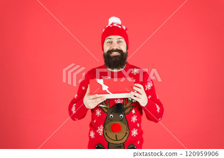 Merry christmas and happy new year. Christmas present concept. Buy thing from wish list. Christmas gift. Guy wear winter hat. Handsome man celebrate winter holidays red background. Christmas shopping Merry christmas and happy new year. Christmas present concept. Buy thing from wish list. Christmas gift. Guy wear winter hat. Handsome man celebrate winter holidays red background. Christmas shopping 120959906