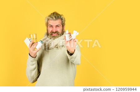 Bottle blister plastic container. Pharmacy concept. Lot of medicines. Man sick leave at home. Medicines effective treatment. Bearded guy messy hair hold pills tablets vitamins medicines in hands 120959944