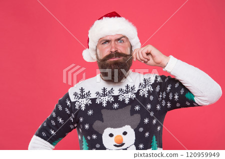 brutal hipster celebrate xmas party. winter holiday preparations. male winter knitwear fashion. happy new year. merry christmas. serious bearded man in santa hat and sweater. Time to celebrate 120959949