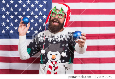 Spread joy. Winter greetings. Having fun. Cheerful hipster. Great american Christmas. Happy santa american flag background. Bearded american man. Celebrate Christmas and new year american way Spread joy. Winter greetings. Having fun. Cheerful hipster. Great american Christmas. Happy santa american flag background. Bearded american man. Celebrate Christmas and new year american way 120959960