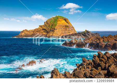 View of the small resort village of Porto Moniz on the Atlantic coast of Madeira Island, Portugal 120959984