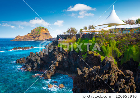 View of the small resort village of Porto Moniz on the Atlantic coast of Madeira Island, Portugal View of the small resort village of Porto Moniz on the Atlantic coast of Madeira Island, Portugal 120959986