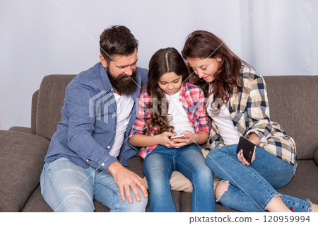 Using mobile phone responsibly. Family send text message. Family time. Smartphone habit Using mobile phone responsibly. Family send text message. Family time. Smartphone habit 120959994