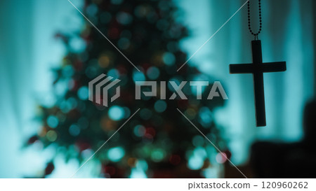 Silhouette Christian Crucifix In Front Of Christmas Tree Turned Off At Night 120960262
