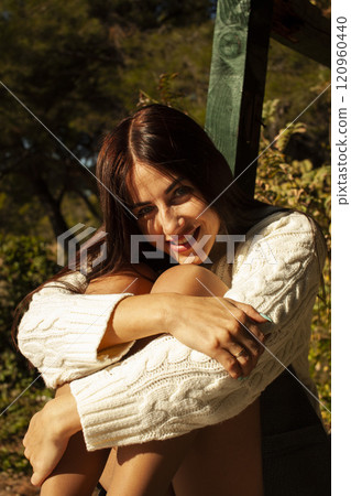 young brunette woman outside in green park sunny day, lifestyle people concept close up 120960440