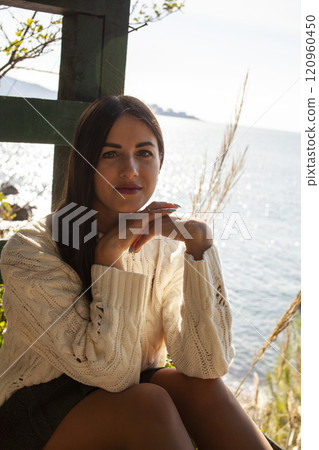 young brunette woman outside in green park sunny day, lifestyle people concept close up 120960450