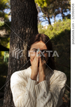 young brunette woman outside in green park sunny day, lifestyle people concept close up 120960456