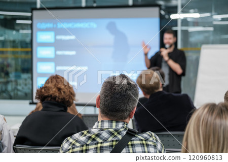 Speaker presenting at business seminar in modern conference room Speaker presenting at business seminar in modern conference room 120960813