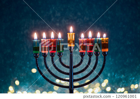 Hanukkah Menorah with burning candles on dark background with bokeh lights. Hanukkah Menorah with burning candles on dark background with bokeh lights. 120961001