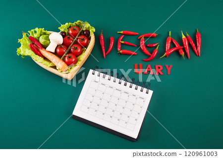 Vegetarian diet month in january called Veganuary. Top view filled veginuary calendar. 120961003