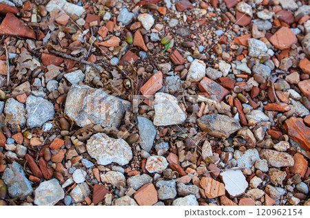 Stones of different colors. Coarse texture. Material for construction. Cobbles of different sizes. 120962154