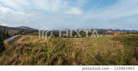 Hazy and overcast Carpathian Mountains and highway on mountain pass, Ukraine. 120963903