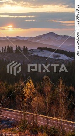 Picturesque sunrise above late autumn mountain countryside. Ukraine, Carpathian Mountains. Peaceful traveling, seasonal, nature and countryside beauty concept scene. Picturesque sunrise above late autumn mountain countryside. Ukraine, Carpathian Mountains. Peaceful traveling, seasonal, nature and countryside beauty concept scene. 120963912