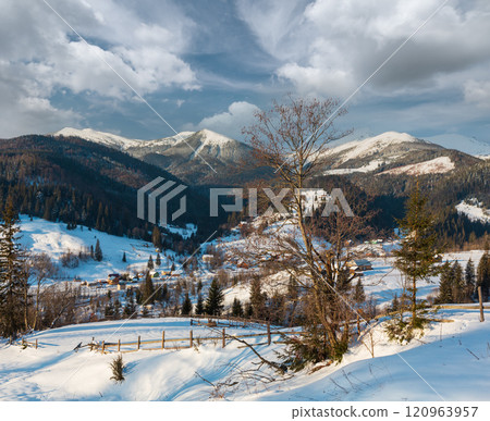 Winter  morning mountain village outskirts and alp ridge 120963957