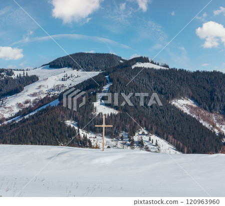 Cross on winter mountain hill top 120963960