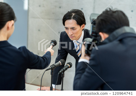 Businessman holding an apology conference 120964741