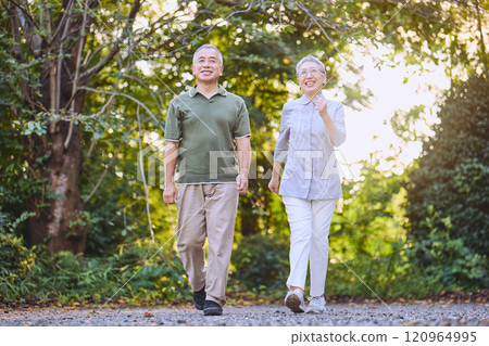 Senior couple doing walking exercises Senior couple doing walking exercises 120964995