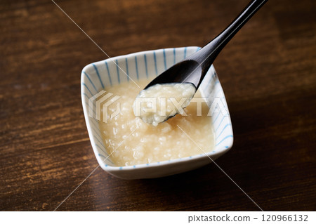 Scoop salted koji with a spoon 120966132