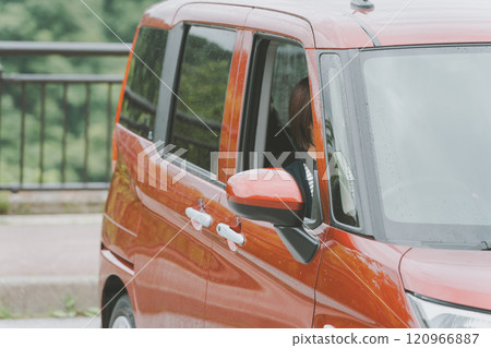 Young woman parking 120966887