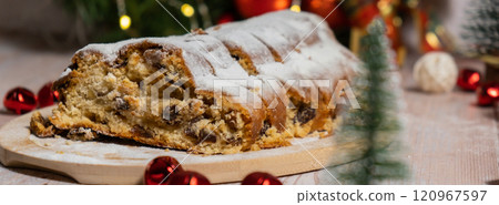 Poster Homemade Christmas traditional cake pie with marzipan nuts and dried fruits pastry dessert stollen. Winter holidays season atmosphere. Delicious tasty composition home table setting 120967597