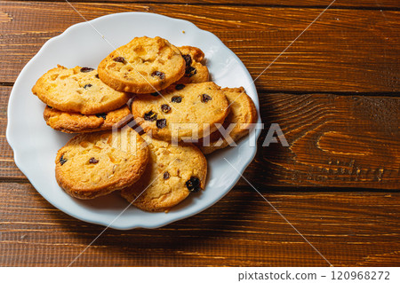 Delicious homemade Christmas cookies with raisins on a white plate 120968272