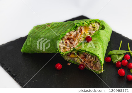Healthy food, fresh pita roll with grilled chicken, vegetables and cranberries 120968371