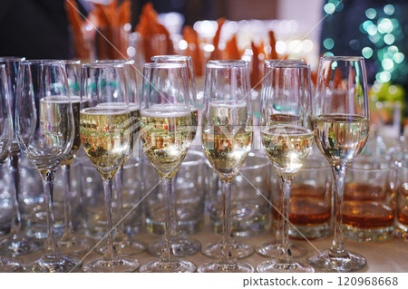 glasses of champagne on the buffet table against the background of appetizers. 120968668
