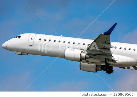 Close-up white passenger airplane in the air on take-off Close-up white passenger airplane in the air on take-off 120969505