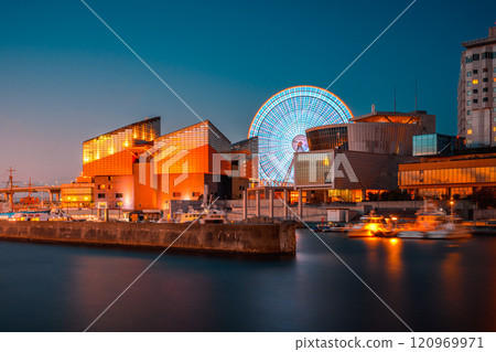 A seaside town bathed in the sunset 120969971