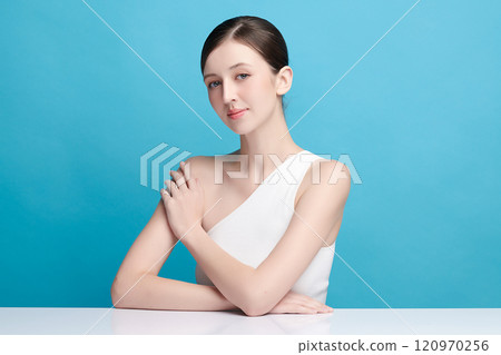 Beautiful young woman with clean fresh skin on blue background, Face care, Facial treatment, Cosmetology, beauty and spa, women portrait. 120970256