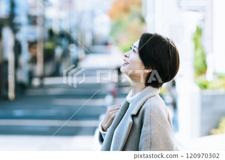 A woman walking in the city A woman walking in the city 120970302