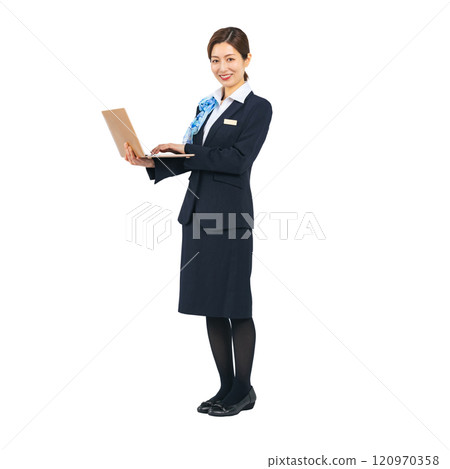Full-body photo of a woman in the service industry using a laptop 120970358