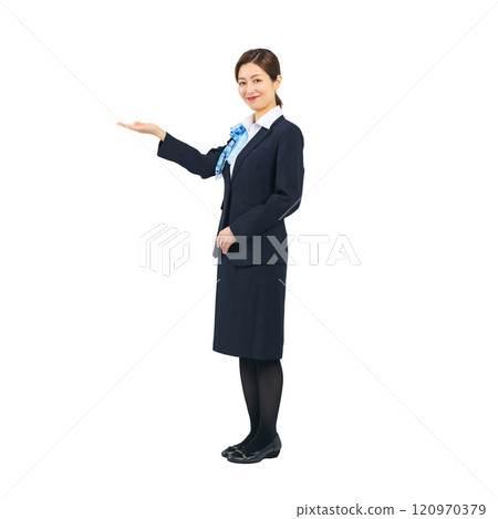 Full-body photo of a woman in the service industry guiding customers 120970379