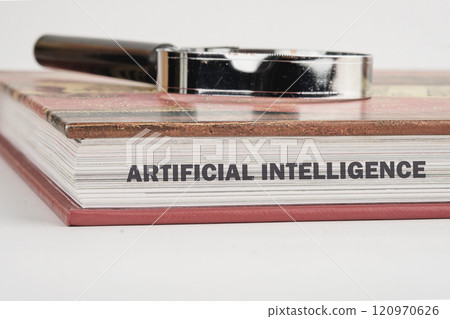The concept of technology and development. Phrase, word, text ARTIFICIAL INTELLIGENCE on the end of the book, a close-up front view 120970626