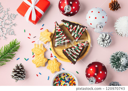 Christmas tree chocolate brownies and cookies with christmas decor on pink background 120970743